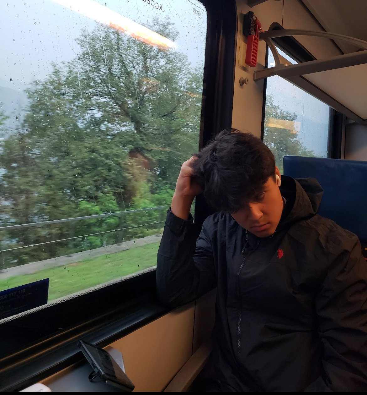 Photo of Ethan Breitkreutz taking a train in switzerland
